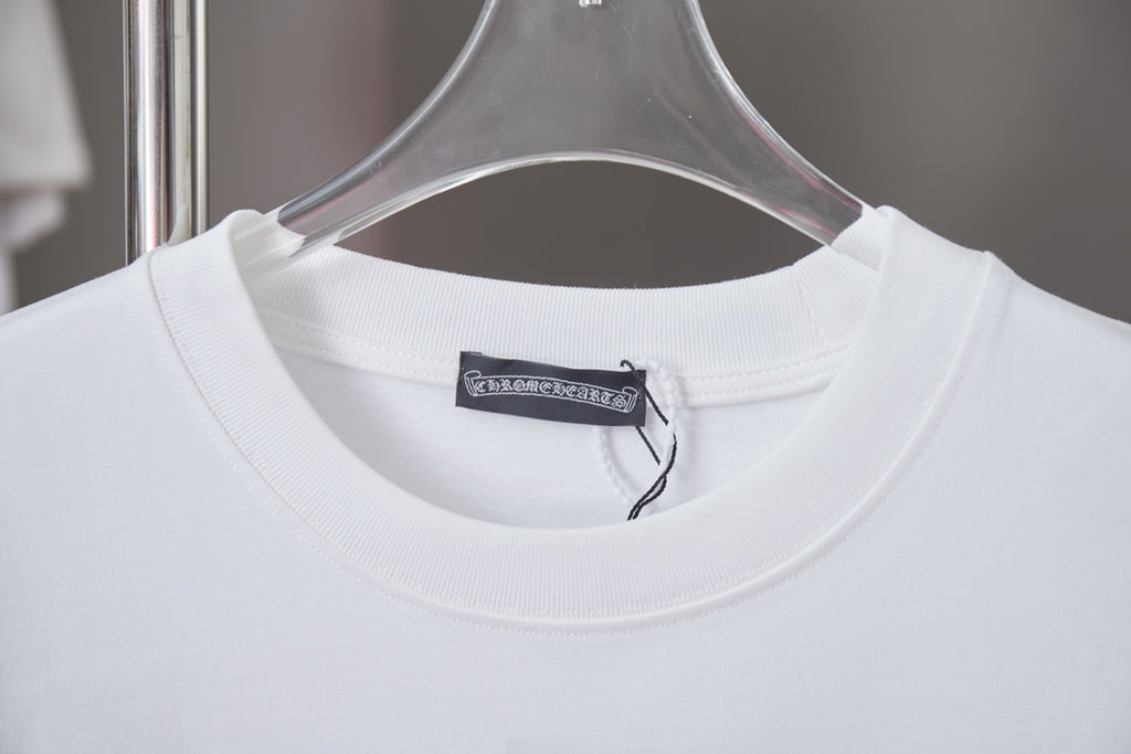 White crewneck T-shirt neckline with brand tag on inside collar