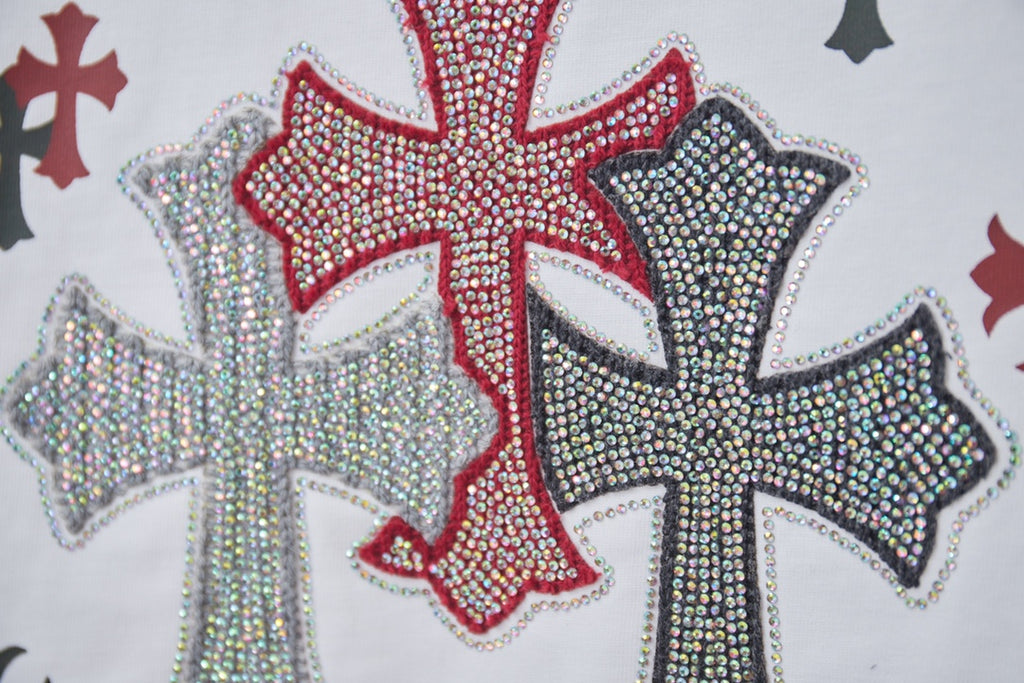 Red and gray rhinestone-style cross graphic on white T-shirt