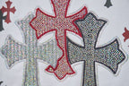 Red and gray rhinestone-style cross graphic on white T-shirt