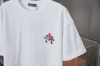 White crewneck short-sleeve T-shirt with red cross patch on left chest
