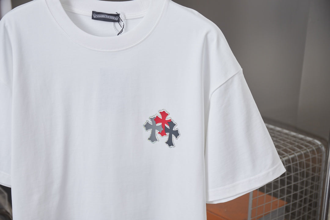 White crewneck short-sleeve T-shirt with red cross patch on left chest