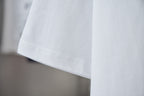 White crewneck short-sleeve T-shirt hem and side seam detail