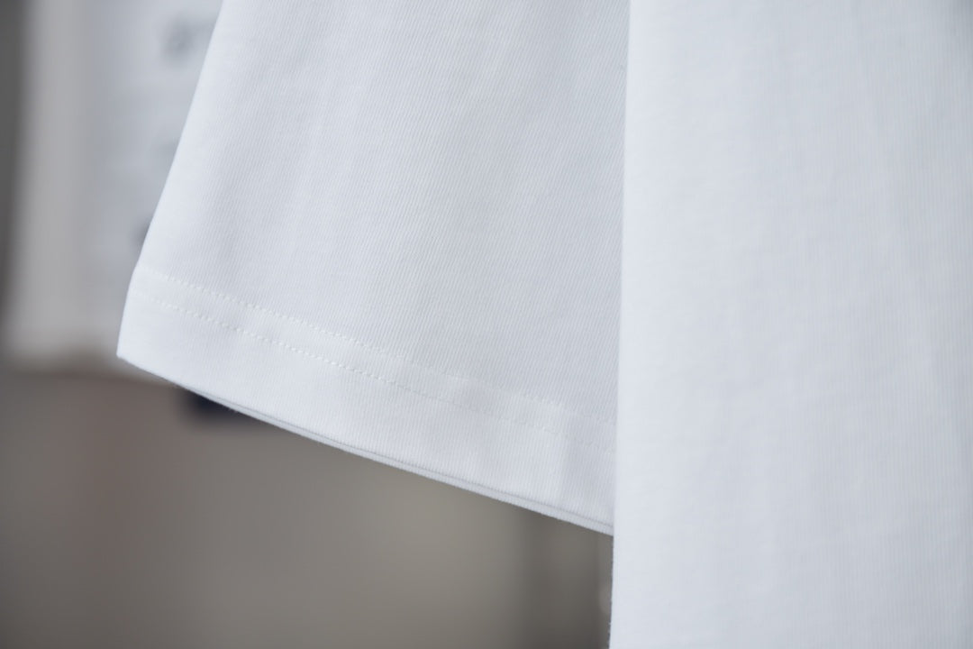 White crewneck short-sleeve T-shirt hem and side seam detail