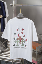 White crewneck short-sleeve T-shirt with cross applique and text on lower back