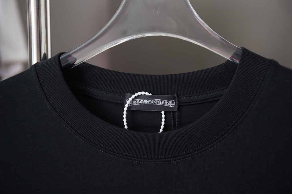 Black crewneck T-shirt with stitched neckline and brand tag on inner collar