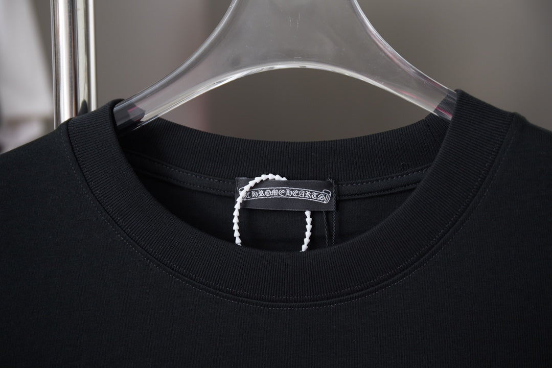Black crewneck T-shirt with stitched neckline and brand tag on inner collar