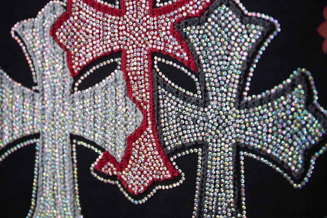 Embellished cross graphic with red center and silver rhinestone trim on black T-shirt