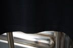 Black T-shirt hem with double-stitched seam