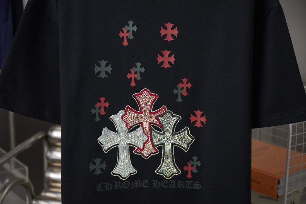 Black short-sleeve T-shirt with red cross and silver dot design; CHROME HEARTS text