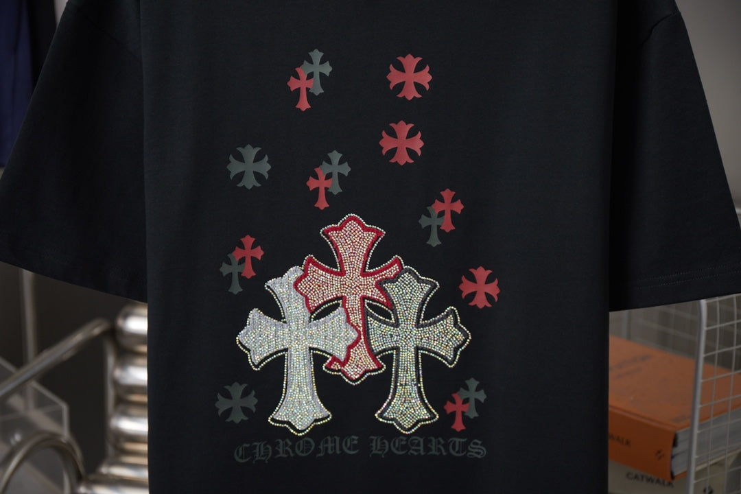 Black short-sleeve T-shirt with red cross and silver dot design; CHROME HEARTS text