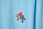 Light blue Chrome Hearts T-shirt panel with red and dark cross embellishment