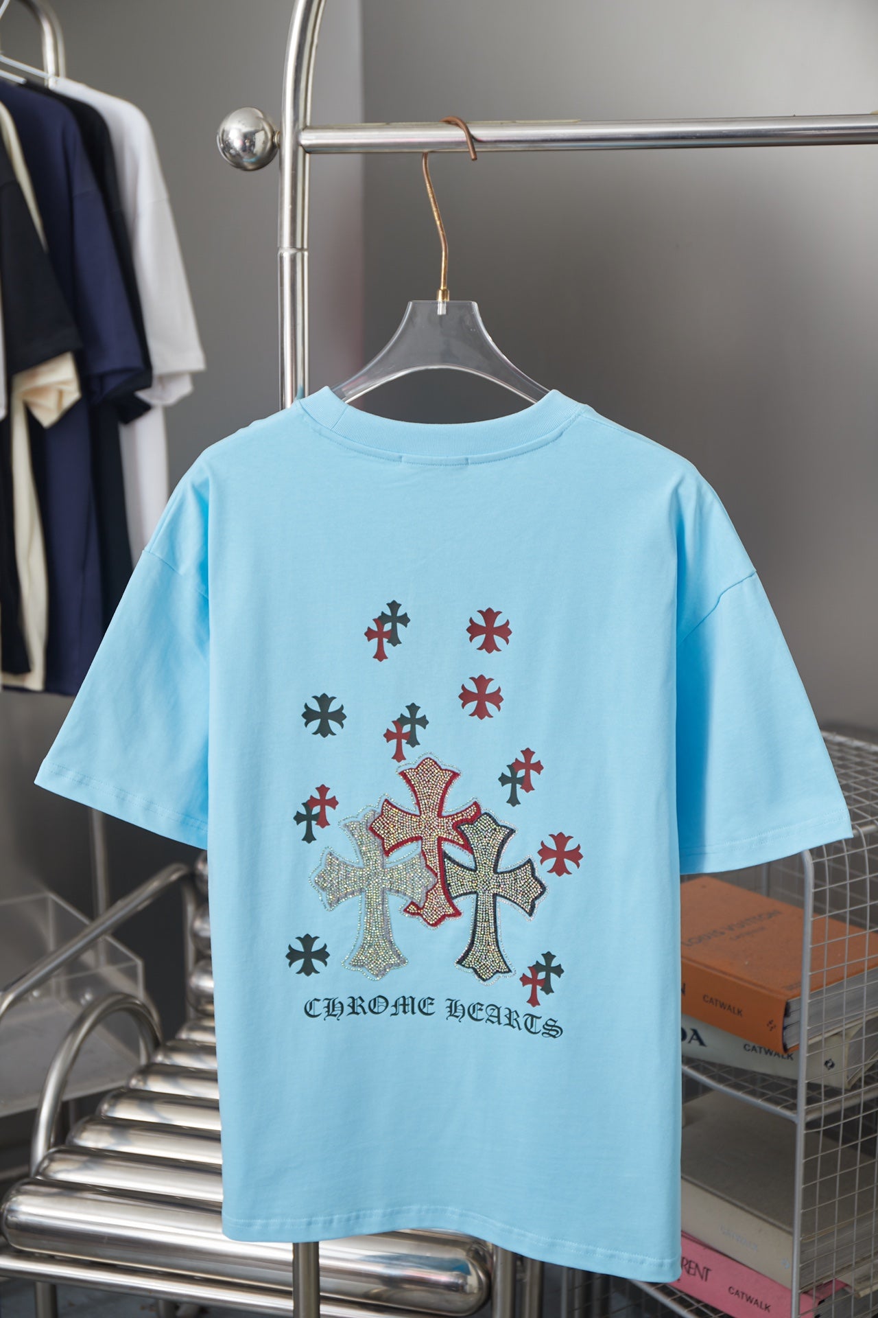 Light blue Chrome Hearts short-sleeve T-shirt back with multicolor cross design and text