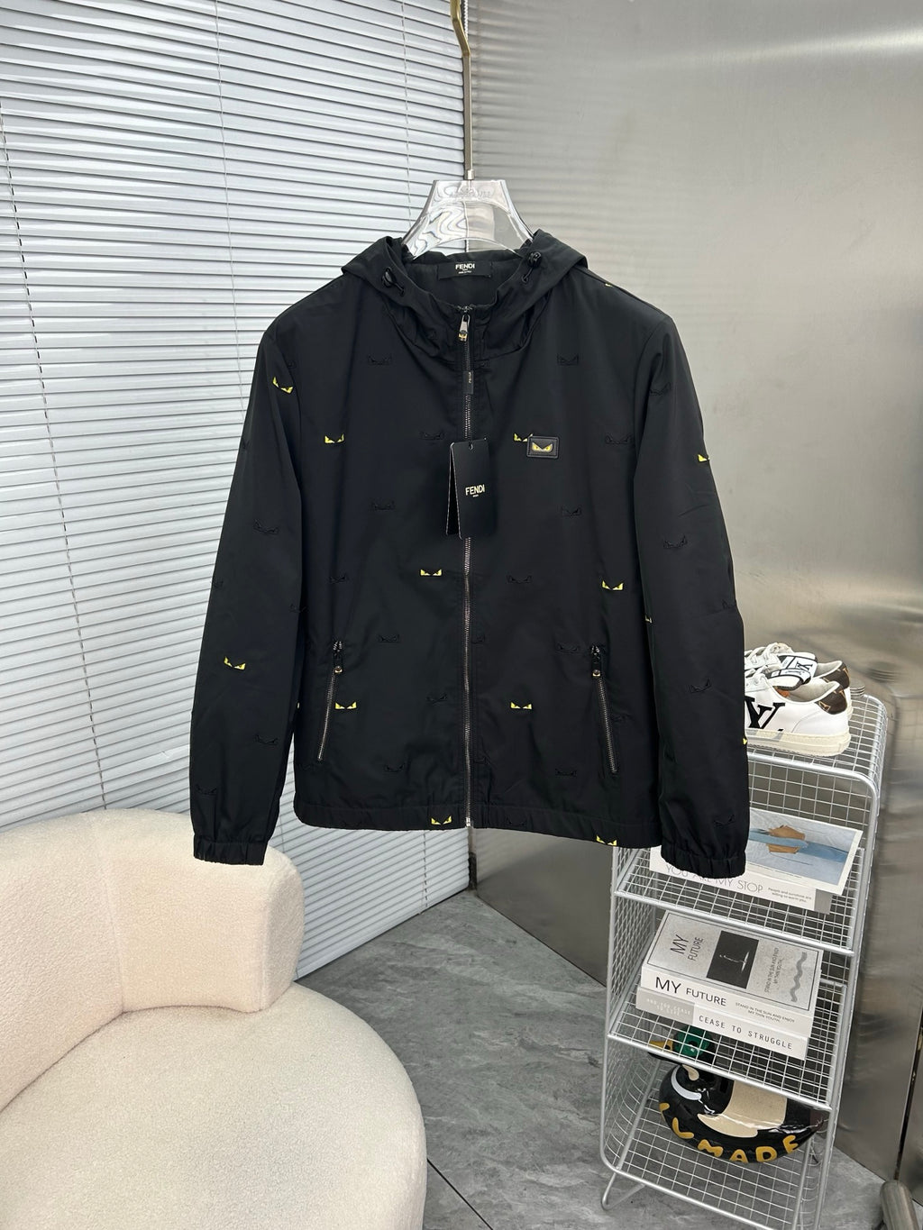 Long hooded jacket in black with yellow mini prints, full front zipper, front pockets