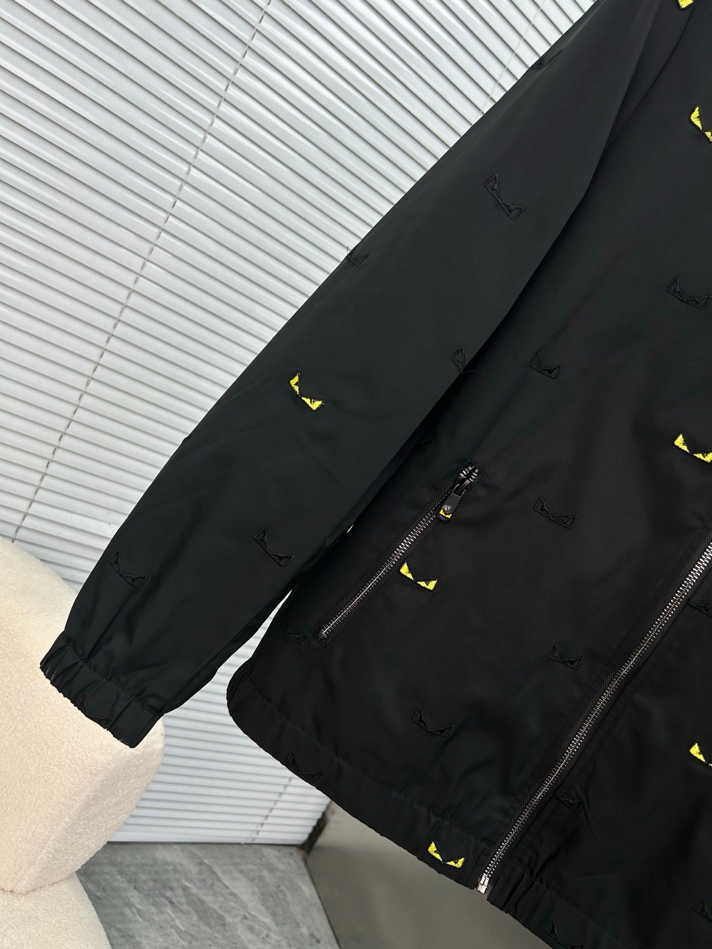Long jacket sleeve and cuff in black with yellow mini prints, side zipper detail