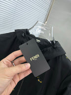 Black hooded jacket with yellow mini prints, hanging Fendi tag
