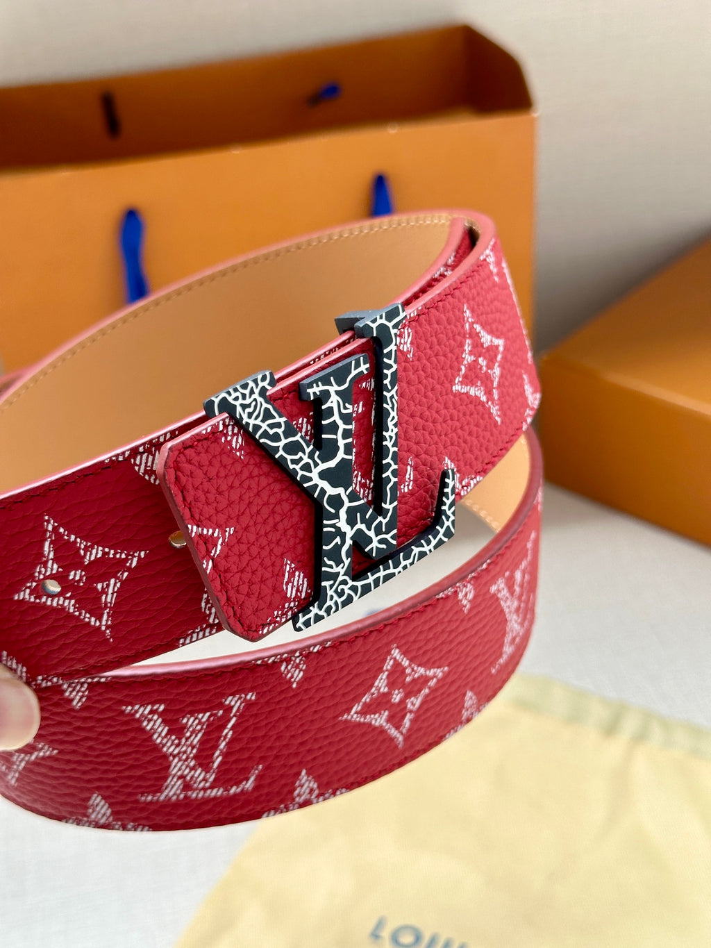 Louis Vuitton belt red monogram strap with gold buckle and patterned keeper