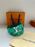 Green Louis Vuitton belt with white monogram pattern and metal LV buckle on pouch