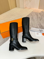 Pair of black leather mid-calf boots with gold logo buckle and block heel