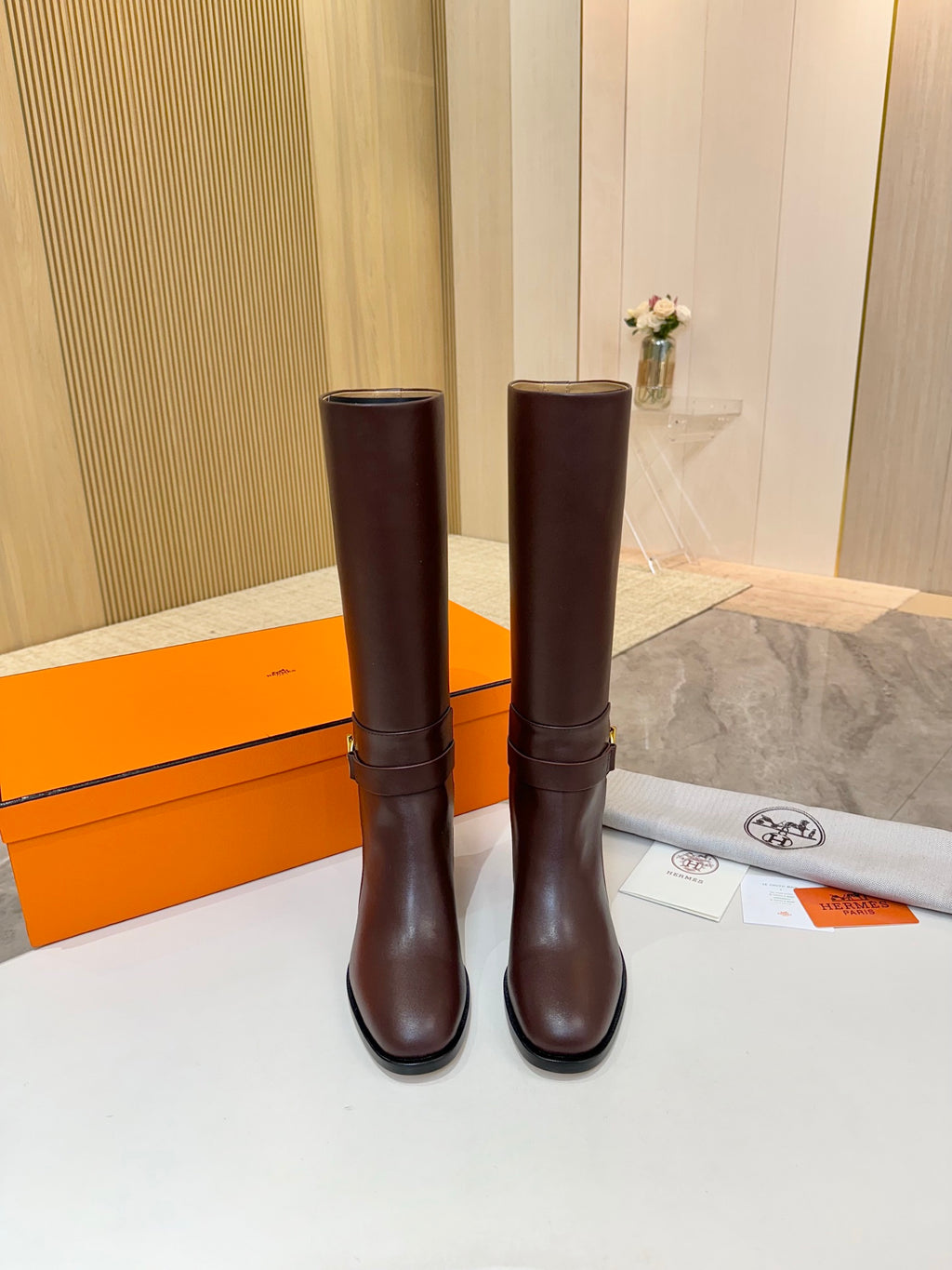 Women's dark brown tall leather boots standing upright with stacked block heels