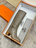 Women’s knee-high gray leather boots with ankle buckle and short stacked block heel