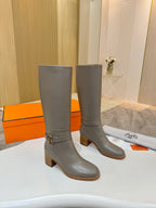 Women’s knee-high gray leather boots with front strap buckle and stacked block heel