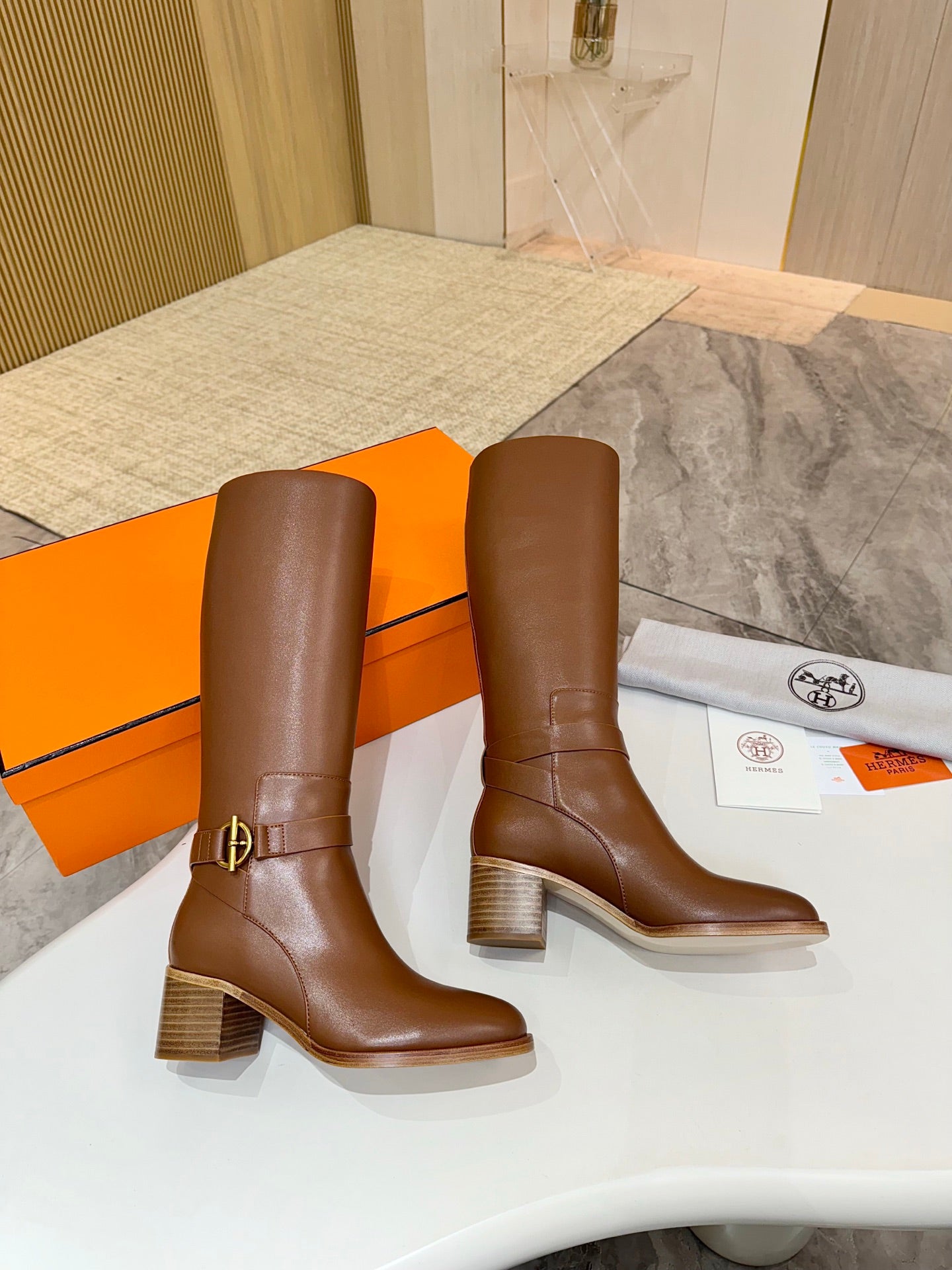 Hermes womens brown knee-high leather boots with block heel, buckle strap detail