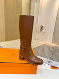 Hermes womens brown knee-high leather boots with gold-tone buckle at ankle and block heel