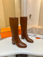 Hermes womens brown knee-high leather boots, side view with gold-tone buckle strap