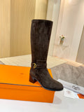 Dark suede knee-high boots with gold-tone buckle strap and block heel