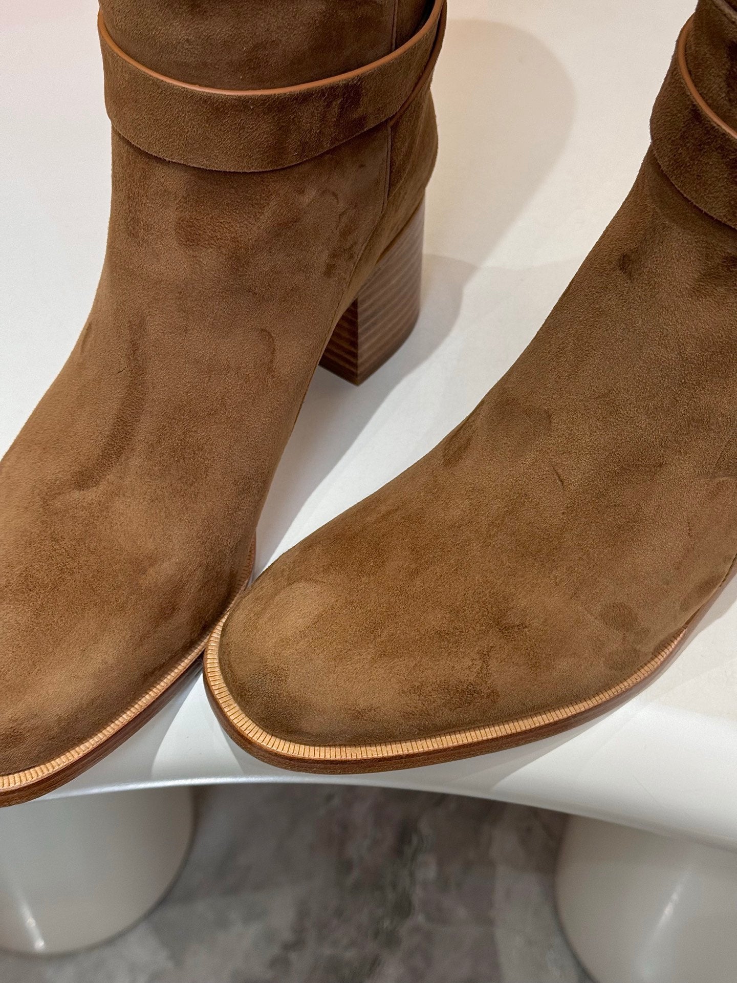 Brown suede boot showing side trim and mid-height block heel
