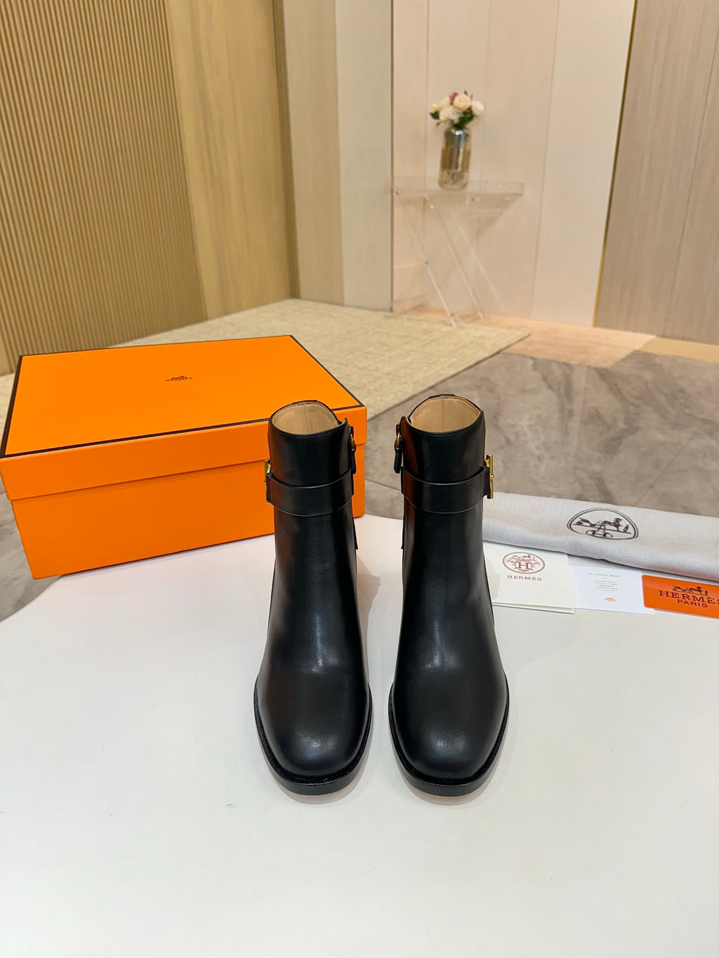 Pair of black leather ankle boots with round toe and chunky block heels