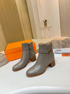 Light gray ankle boots with gold buckle strap and block heel