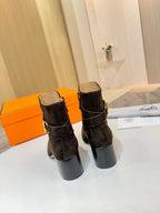 Hermes black suede ankle boots with gold logo buckle and tan interior lining