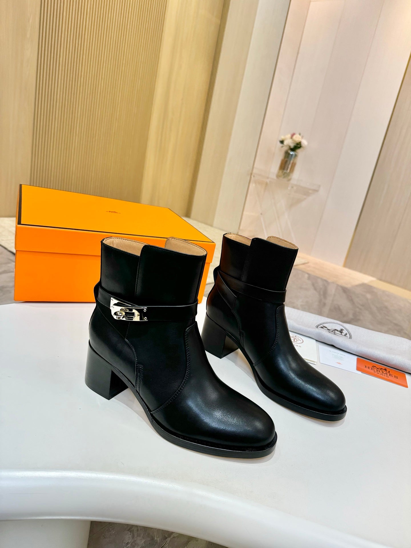 Hermes black leather ankle boots with strap buckle and stacked block heel