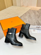 Hermes black leather ankle boots side view, mid-height block heel and strap