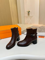 Dark brown leather ankle boots with side buckle detail and block heel