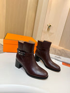 Dark brown leather ankle boots with silver buckle strap and chunky heel