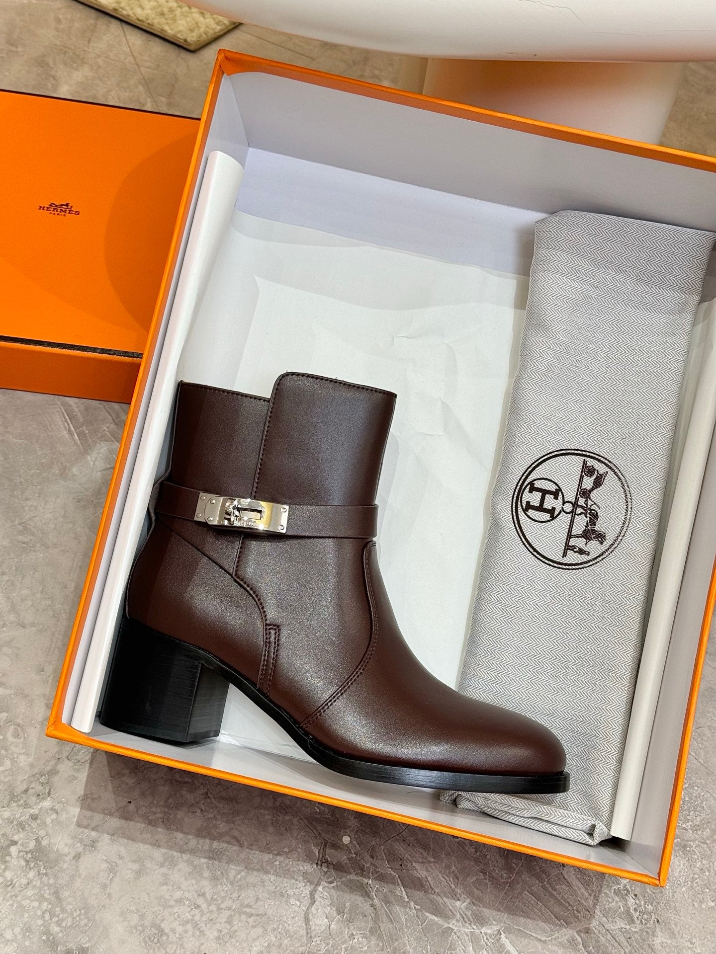 Dark brown leather ankle boot with silver buckle strap in gift box