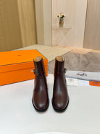 Two dark brown leather ankle boots with rounded toe and stacked block heel