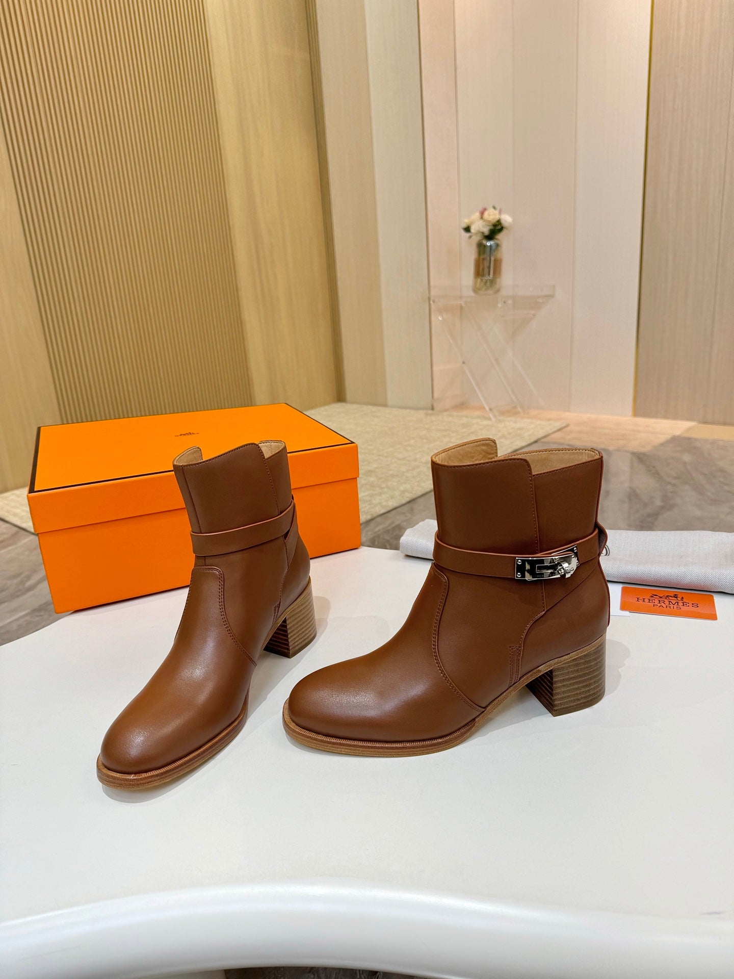 Hermes ladies brown leather ankle boots with strap buckle and mid-height block heel