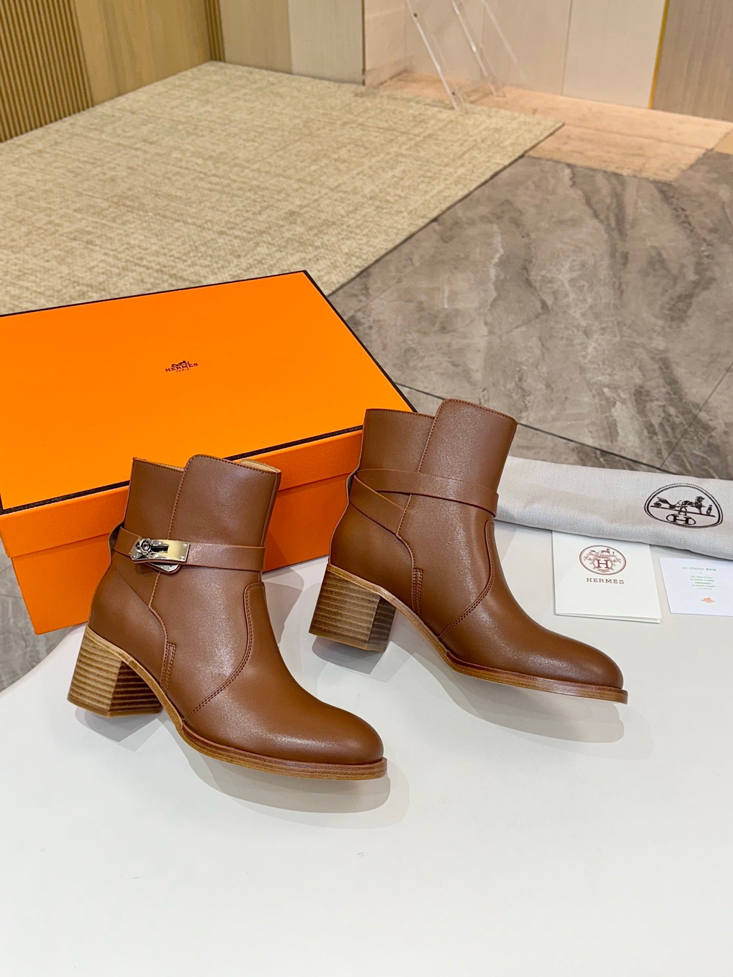 Hermes ladies brown leather ankle boots with buckle strap and block heel pair