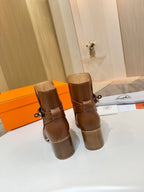 Hermes ladies brown leather ankle boots, stacked back view with chunky block heels