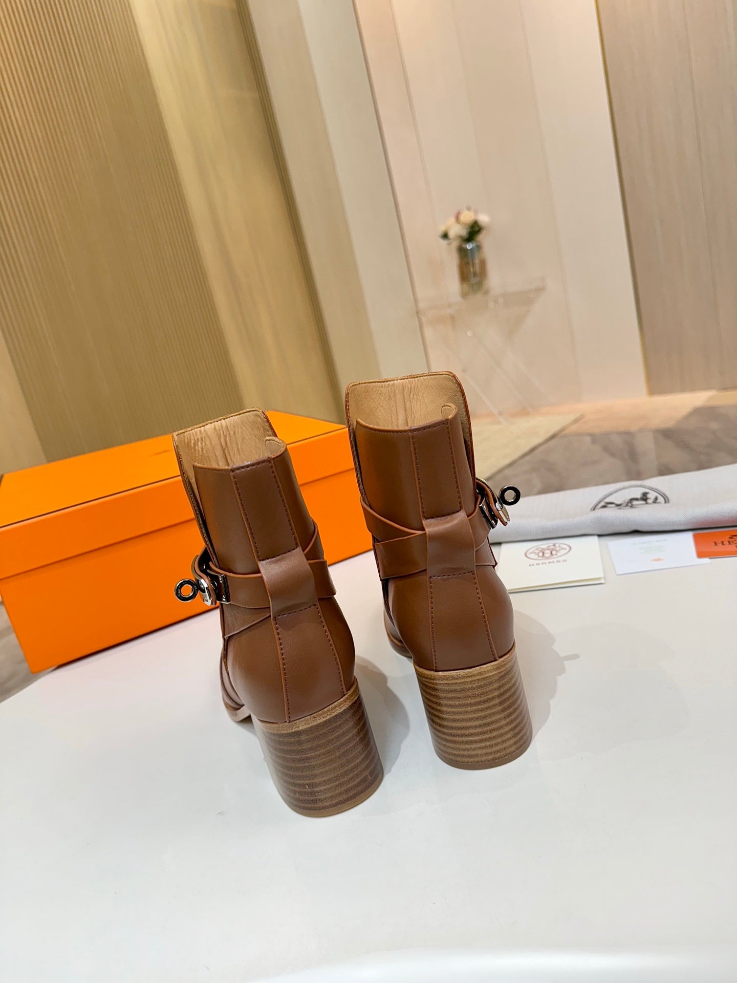 Hermes ladies brown leather ankle boots, stacked back view with chunky block heels