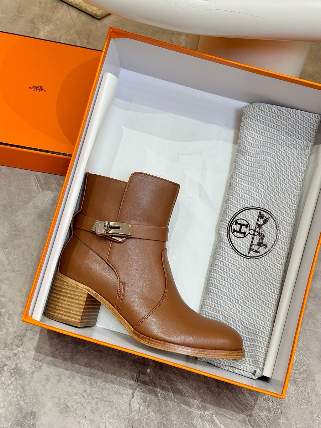 Hermes ladies brown leather ankle boots shown in orange shoe box