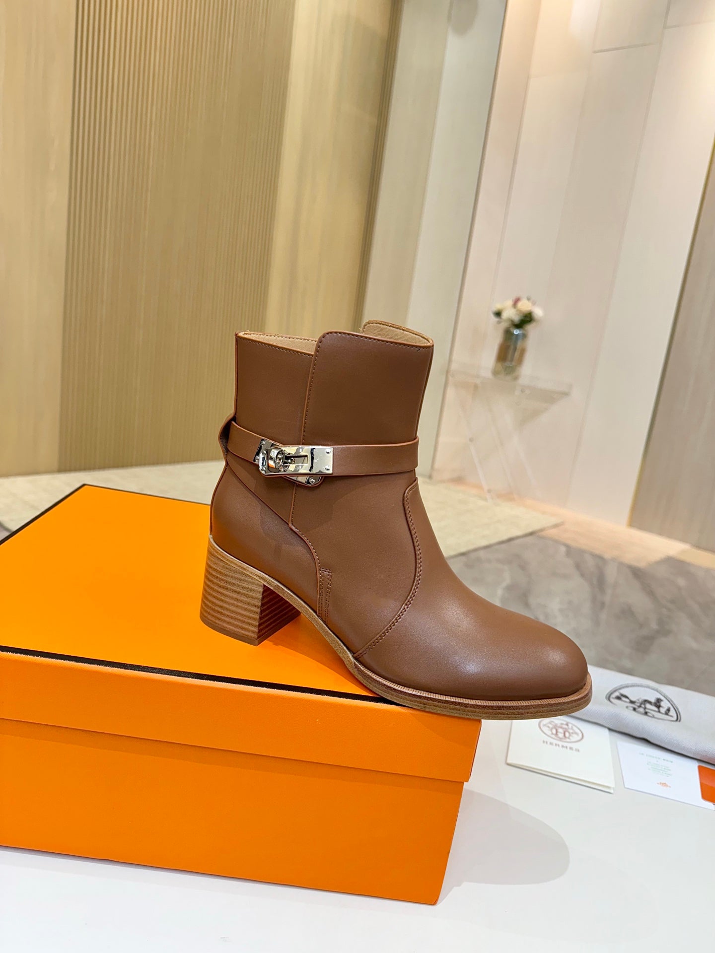 Hermes ladies brown leather ankle boots with buckle strap and block heel