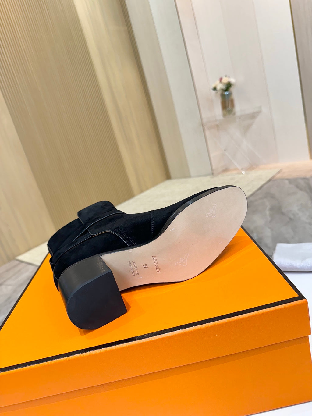 Hermes black suede ankle boot outsole and heel, back view
