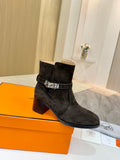 Women’s ankle boots in black suede with side buckle and block heel