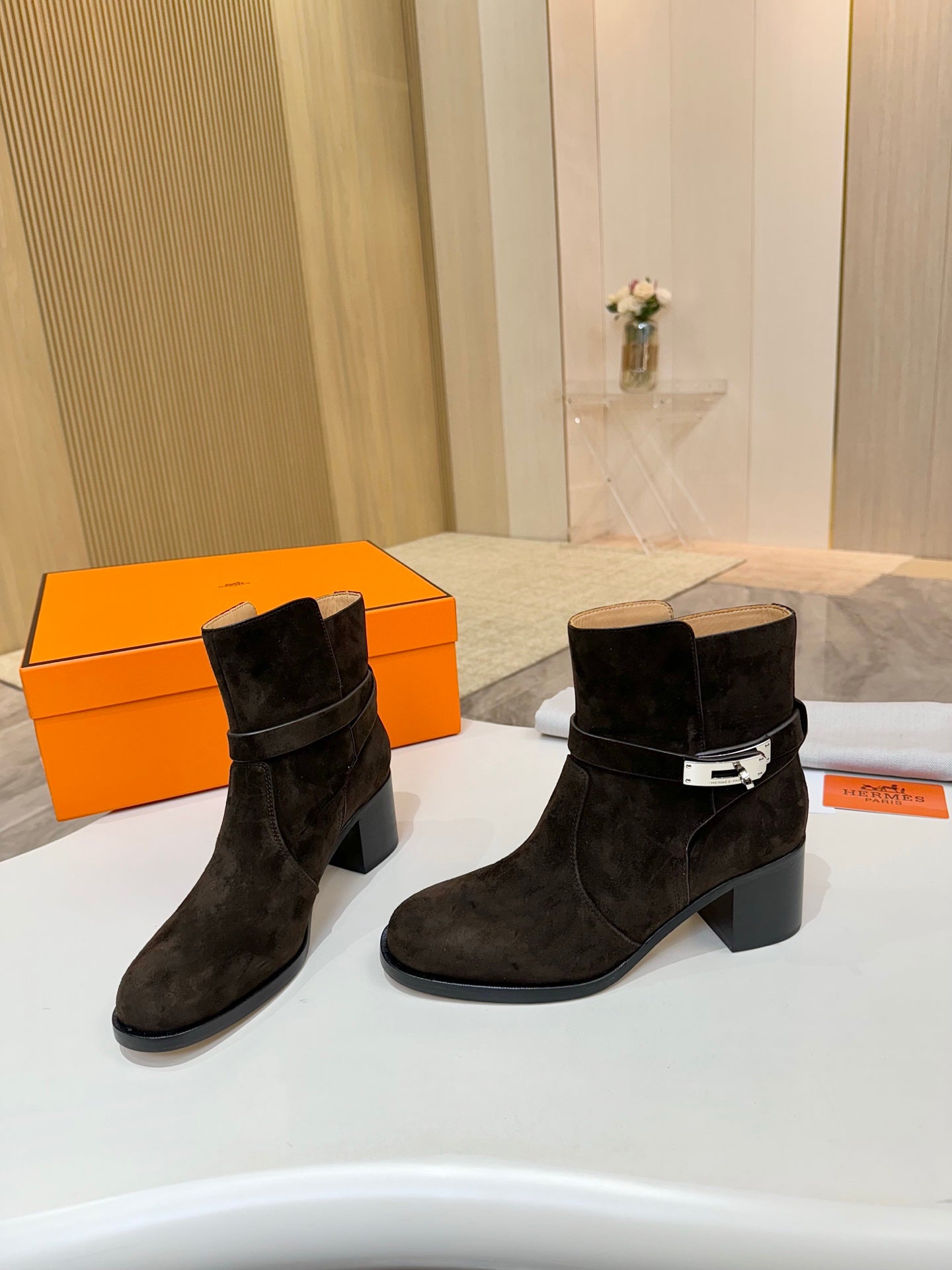 Women’s black suede ankle boots with side buckle strap and chunky block heel
