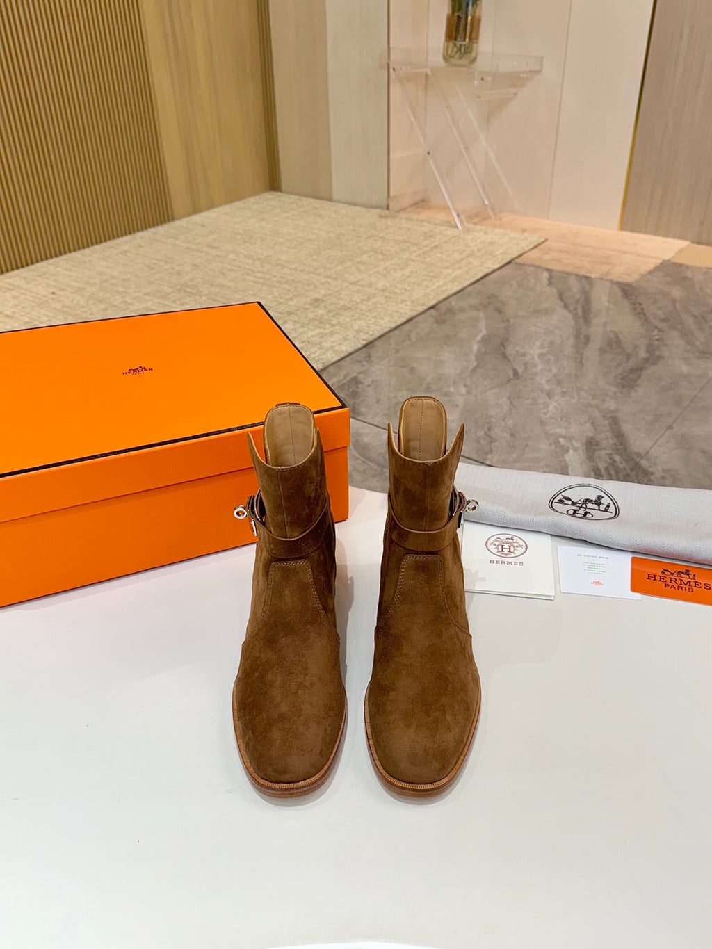 Suede ankle boots standing upright, side buckle, block heel, brown suede