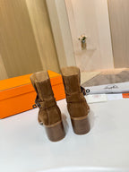 Back view of suede ankle boots with block heel, brown suede and pull tab
